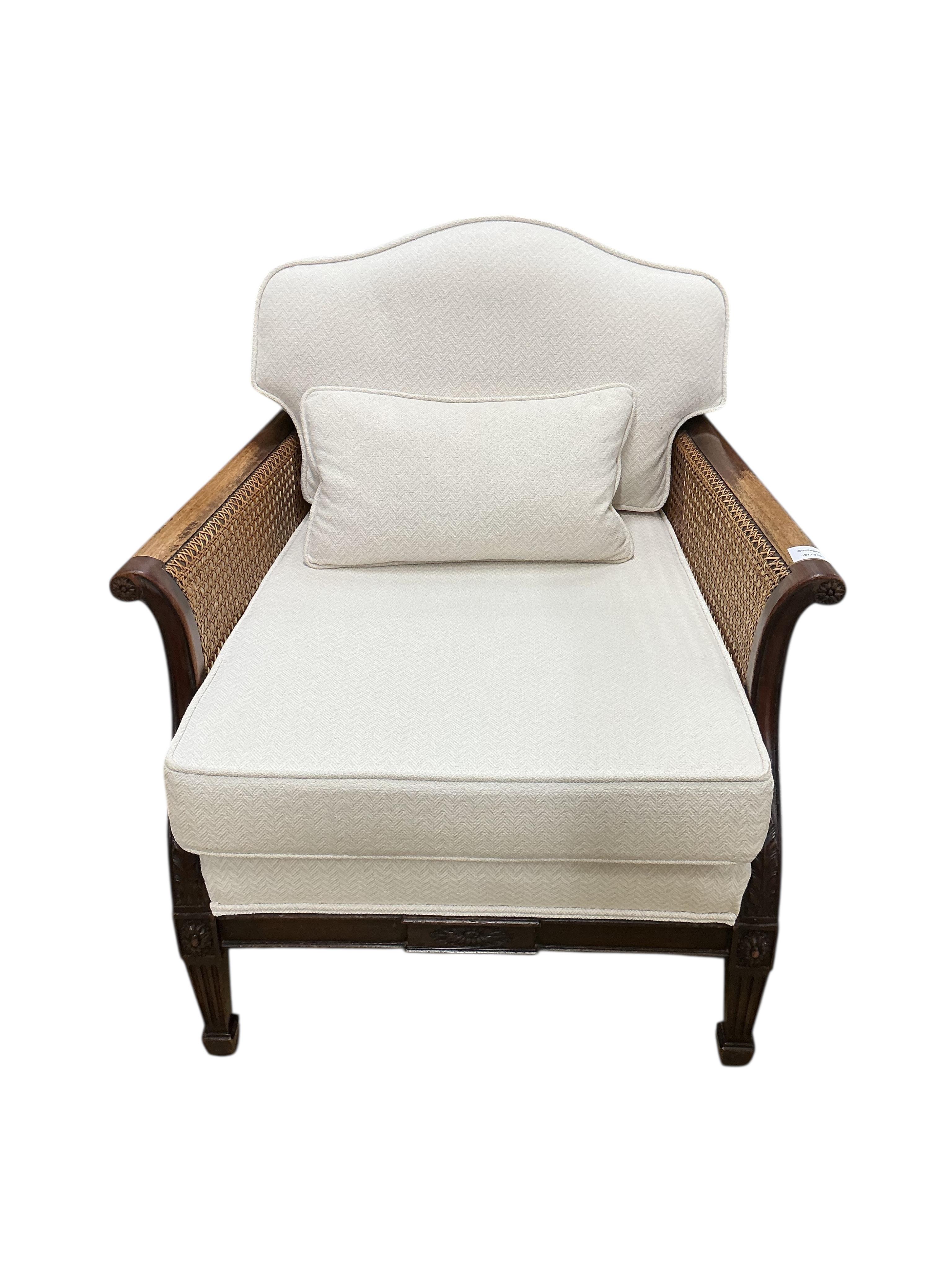 A pair of early 20th century mahogany bergere armchairs, width 75cm, depth 78cm, height 80cm